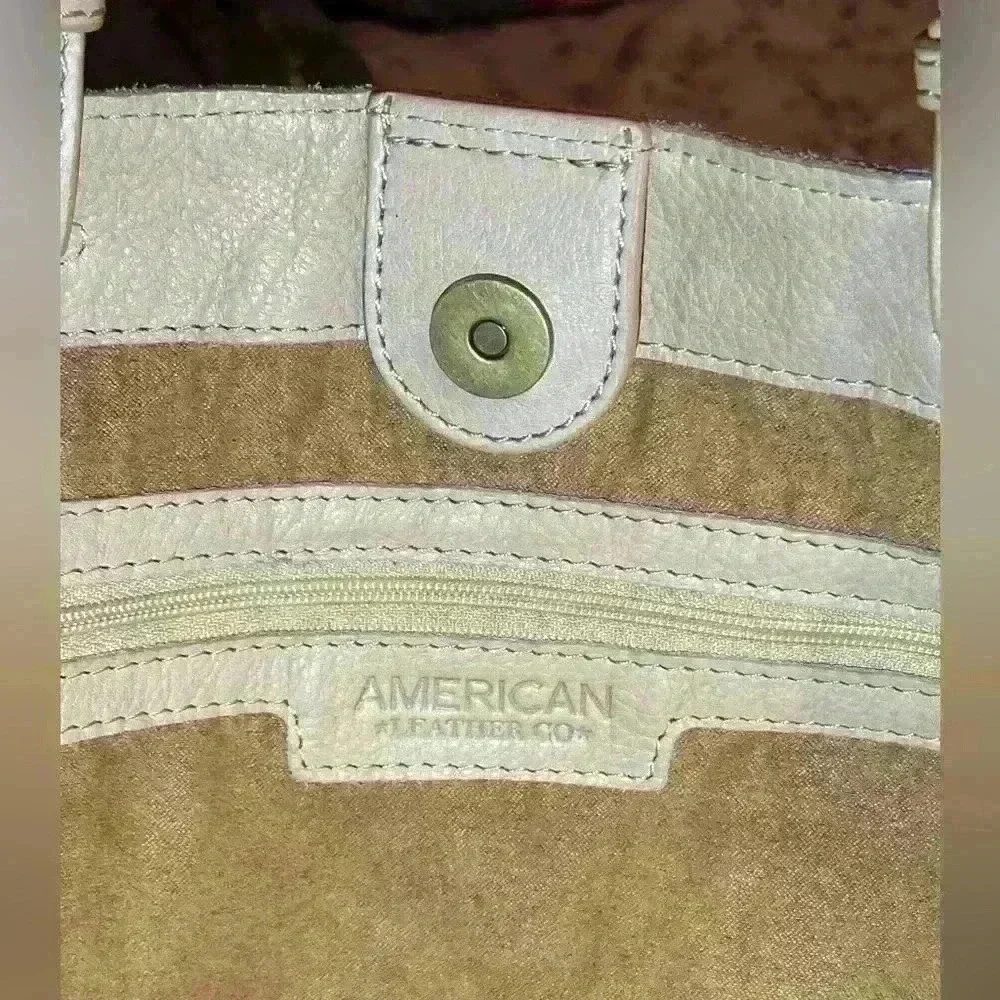 An American Leather Co. nude/cream colored leather woven tote bag.